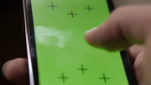 Green screen close up cell phone white hand scrolling trackers markers portrait  Stock Footage 80145115