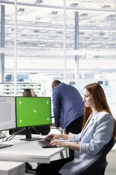Green screen computer, analyzing microchips layout and woman in RD office 스톡 사진