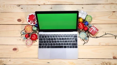 Green screen computer on a desk with Christmas decorations Stock Footage 145543526