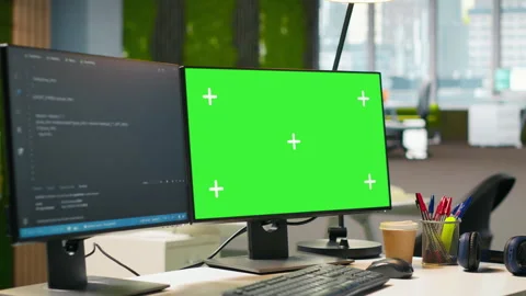 Green screen computer display in modern startup office displaying code snippets Stock Footage 313014607