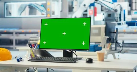 Green screen computer in empty photovoltaics factory used to improve efficiency Stock Photos
