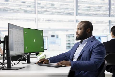 Green screen computer, evaluating PCB system architecture and man Stock Photos