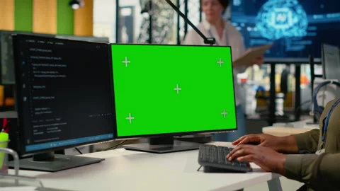 Green screen computer used by admin in office doing software development Stock Footage 322697345
