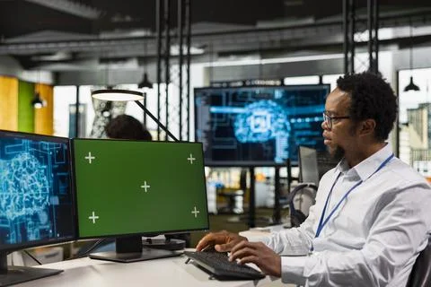 Green screen computer used by IT employee in office automating with AI 写真素材