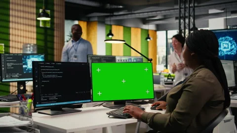 Green screen computer used by programmer in AI startup office Stock Footage 323144052