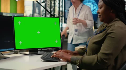 Green screen computer used by programmer in AI startup office Stock Footage 323237338