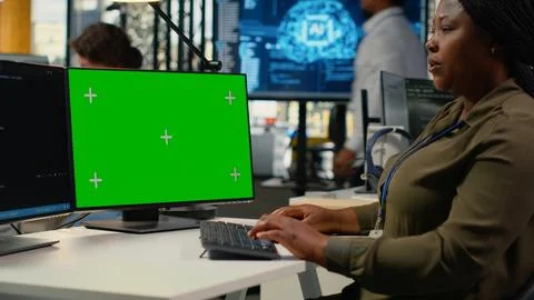 Green screen computer used by programmer in AI startup office Stock Photos