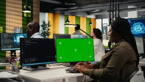Green screen computer used by programmer in AI startup office Stock Photos