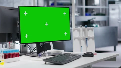 Green screen desktop pc on a desk in empty laboratory setting Video stock 318423699