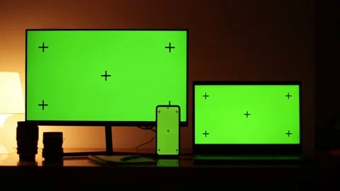 Green screen with dots for tracking movement on the screens of three devices, a Stock Footage 219370302