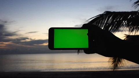 Green screen electronic device to record the seashore at sunset. Stock-Footage 117916641