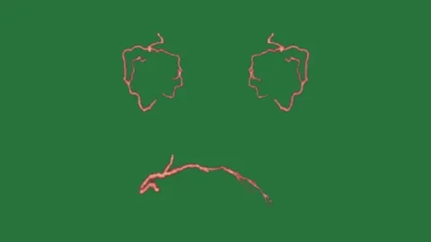 A green screen with face drawn on it and an image of animated chromakey Stock Footage 335683171