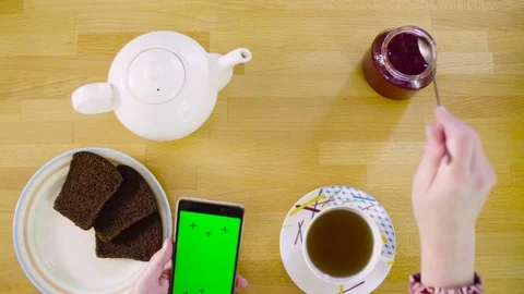 Green screen. Female hands scrolling smart phone Stock-Footage 84675220