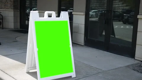 A Green Screen Foldout Sign outside of business Stock Footage 314686544