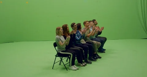 GREEN SCREEN Front view group of young people sitting and applause Stock Footage 105841237