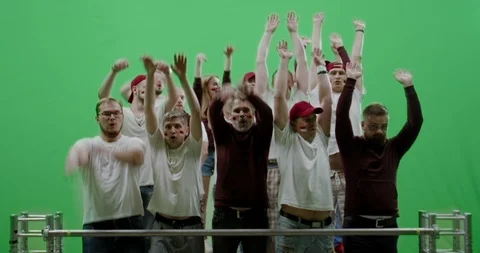 GREEN SCREEN Front view group of people fans doing a wave Stock Footage 110358855