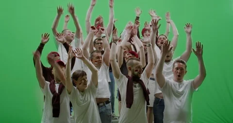 GREEN SCREEN Front view group of people fans doing a wave Stock Footage 110383779