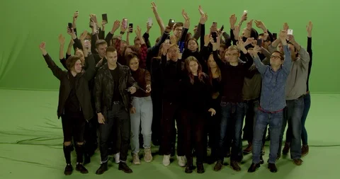 GREEN SCREEN Front view huge crowd jumping and cheering at a concert or a show Stock Footage 125621282