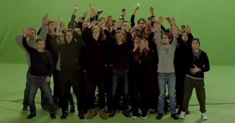 GREEN SCREEN Front view huge crowd jumping and cheering at a concert or a show Stock Footage 125624420