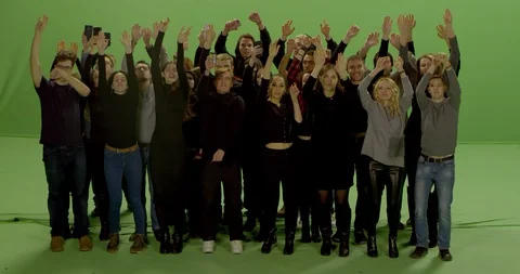 GREEN SCREEN Front view huge crowd jumping and cheering at a concert or a show Stock Footage 125626652