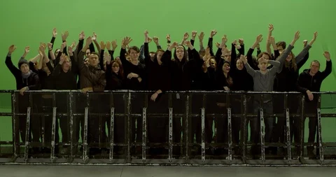 GREEN SCREEN Front view huge crowd dancing and cheering behind control barrier Stock Footage 125628388