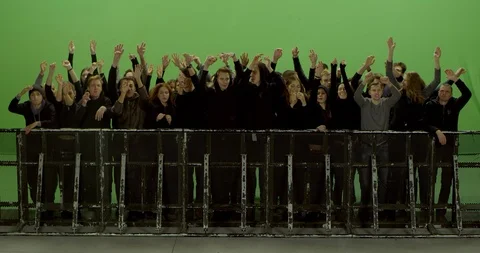 GREEN SCREEN Front view huge crowd dancing and cheering behind control barrier Stock Footage 125635265