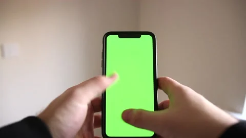 Green Screen Hand Shot of Young Man Typing and Swiping on Smartphone Stock Footage 148144844