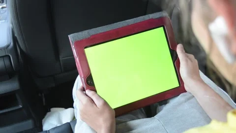 Green screen of hands holding iPad for keying Stock Footage 247125810