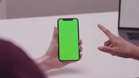 Green Screen  on iPhone with and 2 Women's Hands Pointing Stock Footage 134566427