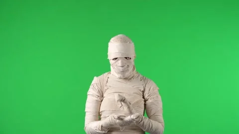 Green screen isolated chroma key video capturing a mummy clapping its hands Stock Footage 252612504