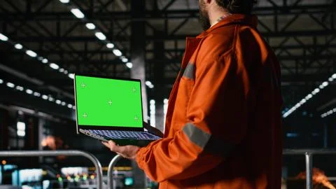 Green screen, isolated laptop, engineer man, production line Stock Photos