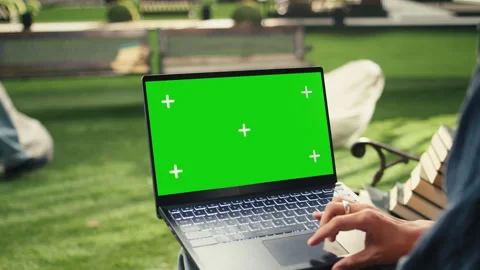 Green screen isolated laptop shown on outdoor campus study with student Stock Footage 340810427