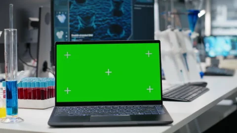 Green screen laptop and computer monitor in laboratory Stock Footage 320143526