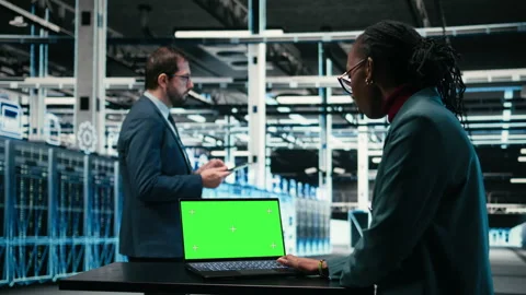 Green screen laptop, AR simulation and software developer in data center Stock Footage 329452802