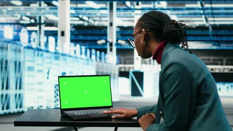 Green screen laptop, AR simulation and software developer in data center Stock Footage 329945089