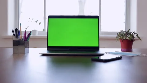 Green screen laptop computer sitting on a home work desk. Stock Footage 149042355