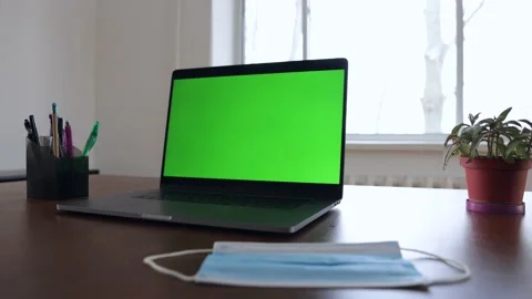 Green screen laptop computer sitting on a home work desk. Stock Footage 149042580