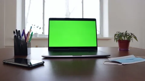 Green screen laptop computer sitting on a home work desk. Stock Footage 149042648