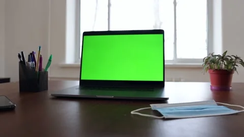 Green screen laptop computer sitting on a home work desk. Stock Footage 149042818