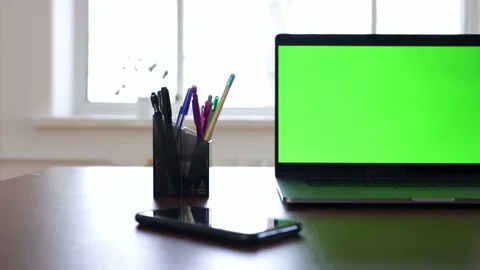 Green screen laptop computer sitting on a home work desk. Stock Footage 149042841