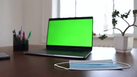Green screen laptop computer sitting on a home work desk. Stock Footage 149042869