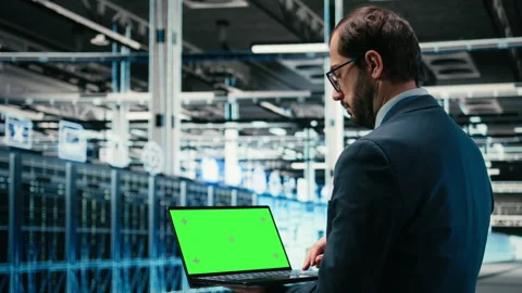 Green screen laptop in data center and AR tech used by technician Stock Footage 329651133