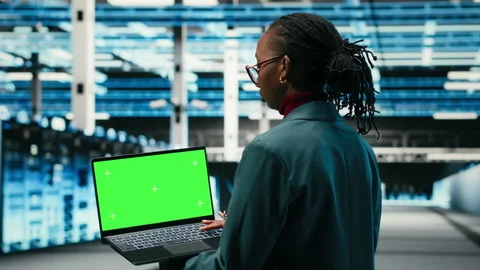 Green screen laptop in data center and AR tech used by technician Stock Footage 329651699