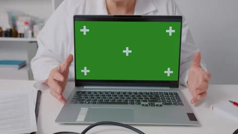 Green screen laptop doctor explaining in while sitting in health clinic Stock Footage 299633156