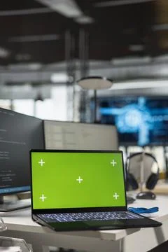 Green screen laptop in empty AI startup office used by programmers Stock-Fotos