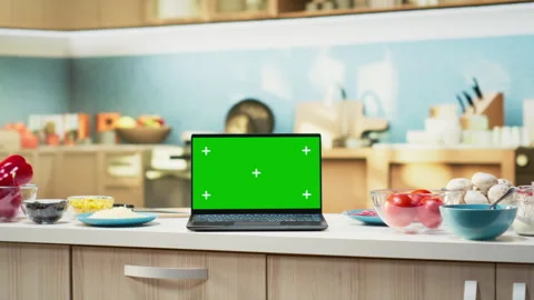 Green screen laptop in empty kitchen with island and modern appliances Stock Footage 320722302