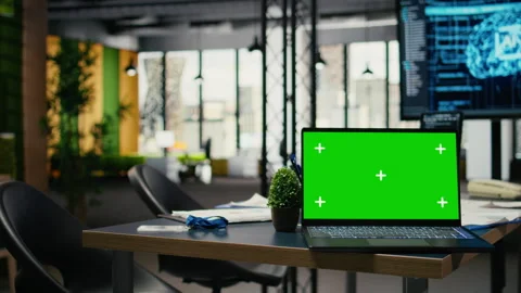 Green screen laptop in empty office used to accelerate AI calculations Video stock 323143331