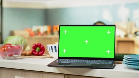Green screen on laptop in the kitchen with rustic counter and elegant lighting Stock Footage 321314569