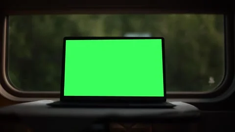 A green screen on a laptop on a moving train. Traveling by rail Stock Footage 280410599