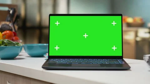 Green screen on a laptop placed on empty table in rustic kitchen space Stock Footage 327332164
